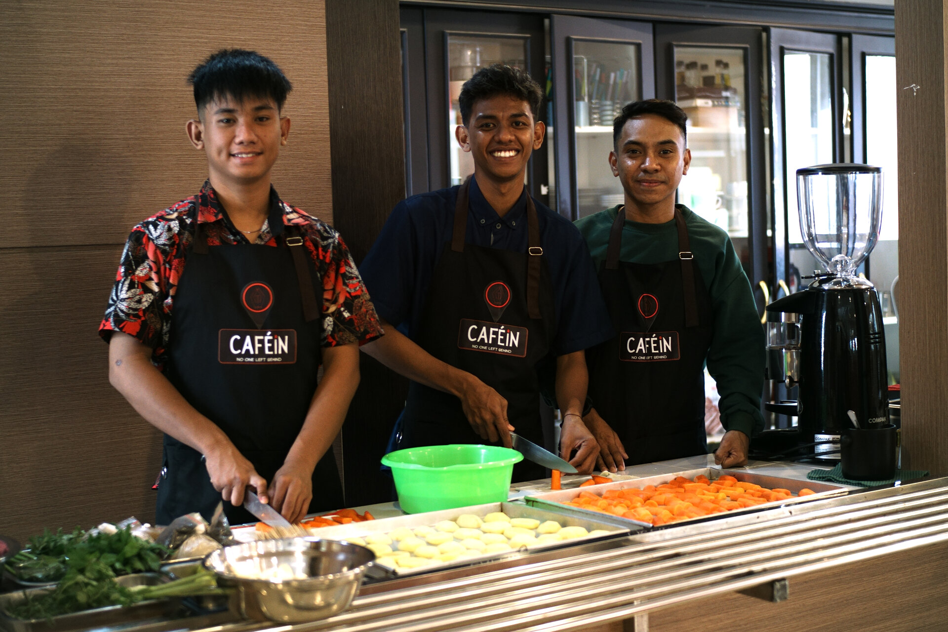 (Left to right) Baristas Daniel, Frengki and Tanel step out of their comfort zones and rise to the cooking challenge.